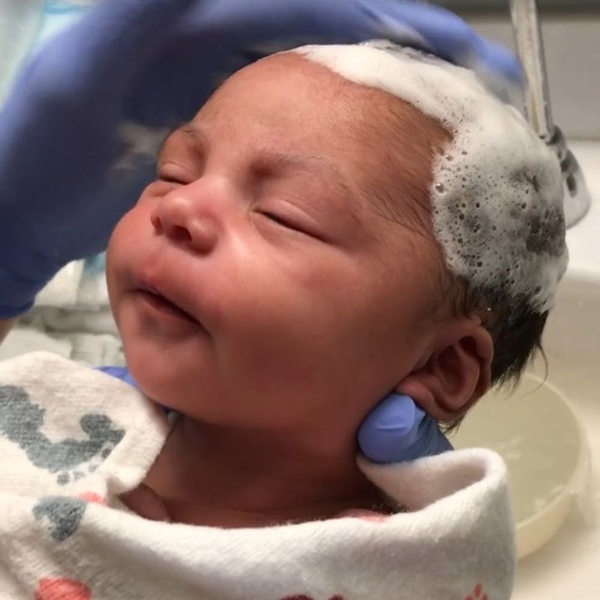 This Newborn Baby’s Reaction to Getting Her Hair Washed Is Almost Too Sweet to Handle
