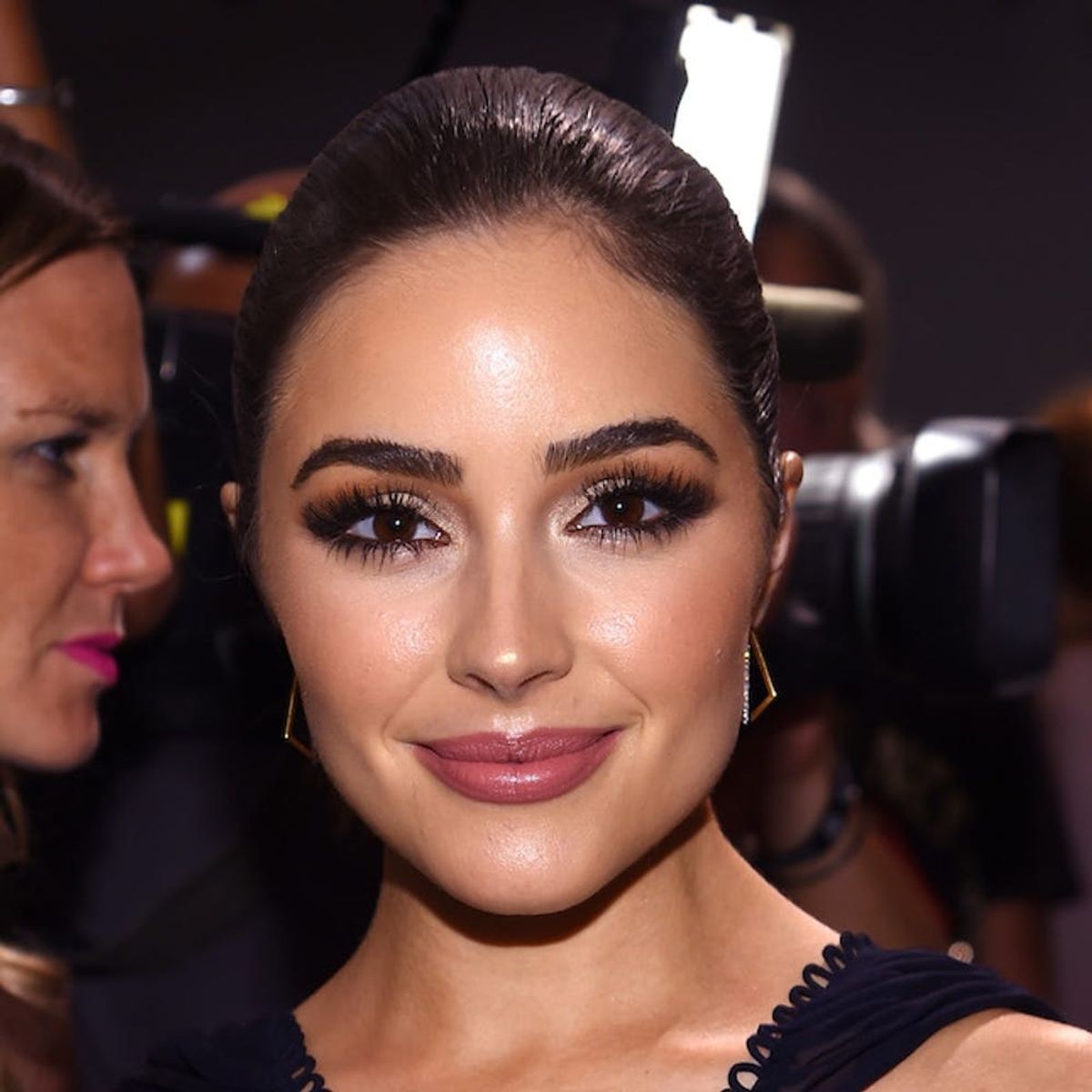 Olivia Culpo’s Silky Trench Will Be Your New Go-To Airport Staple