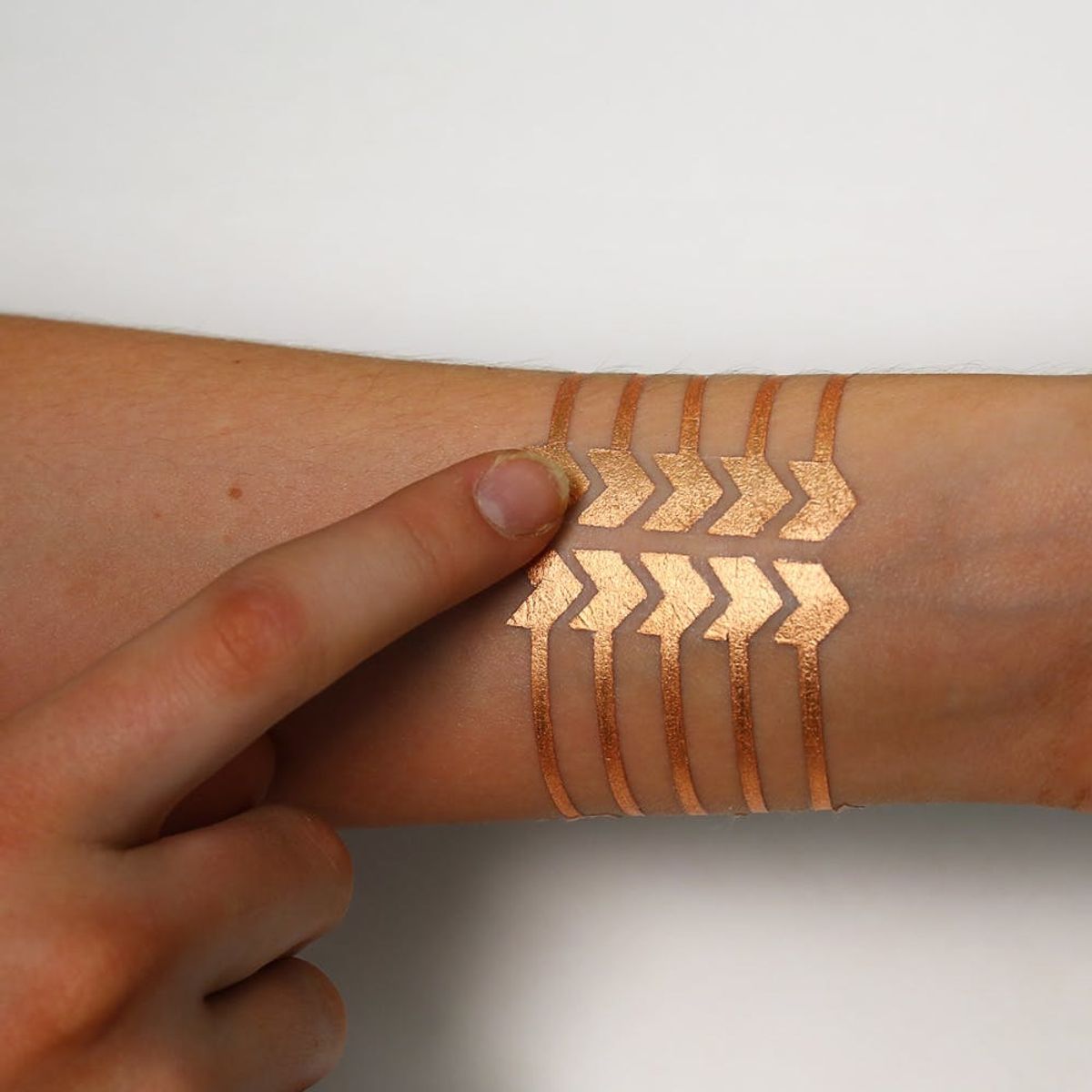 In the Future, We’ll Control Our Phones With Beautiful Gold Tattoos