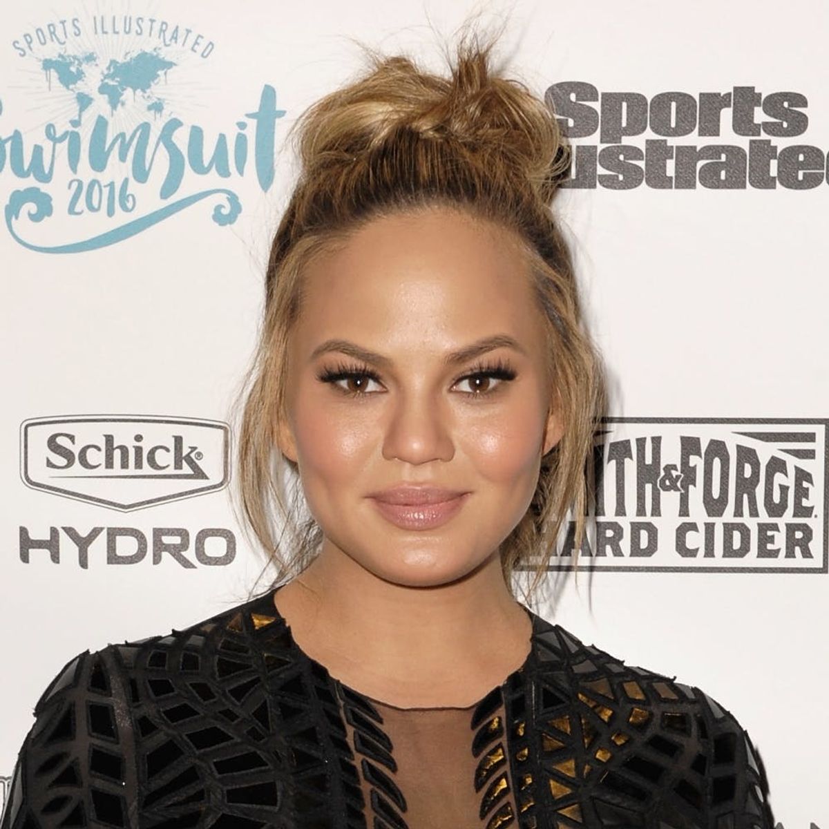 Chrissy Teigen Steps Out in Sheer Baby-Bump-Baring Crop-Top