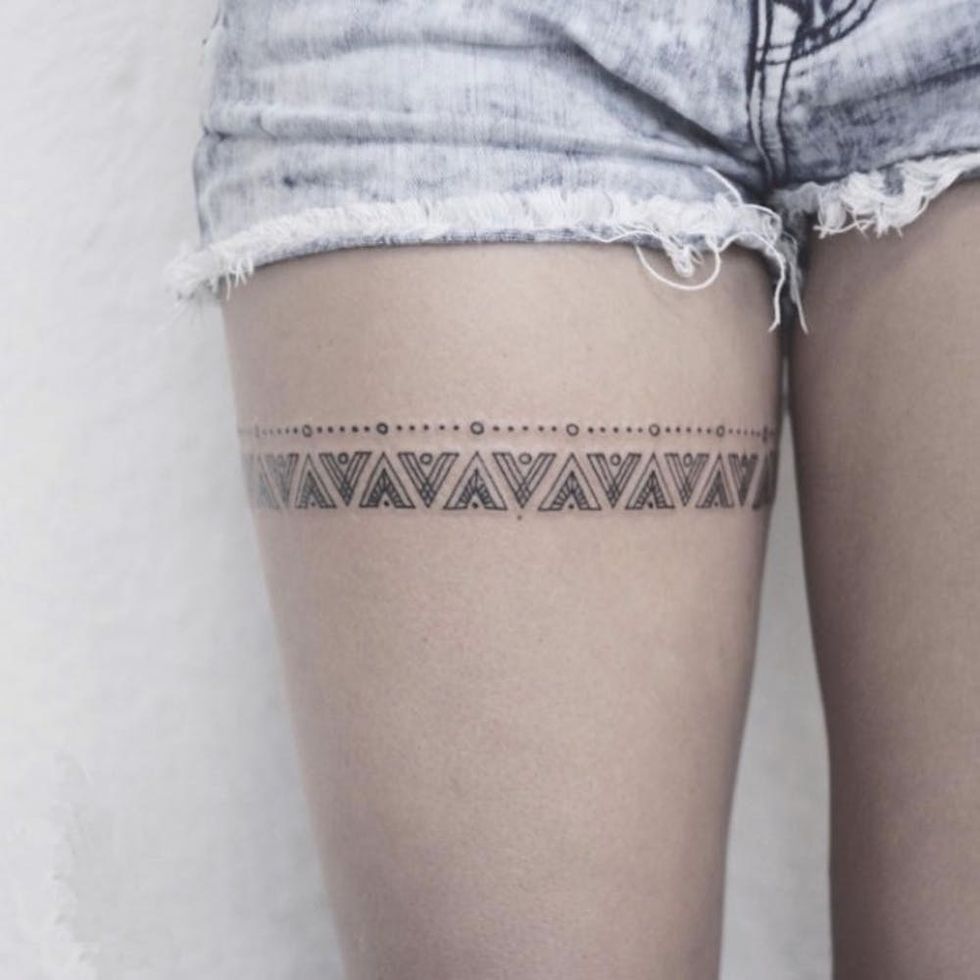 thigh garter tattoo