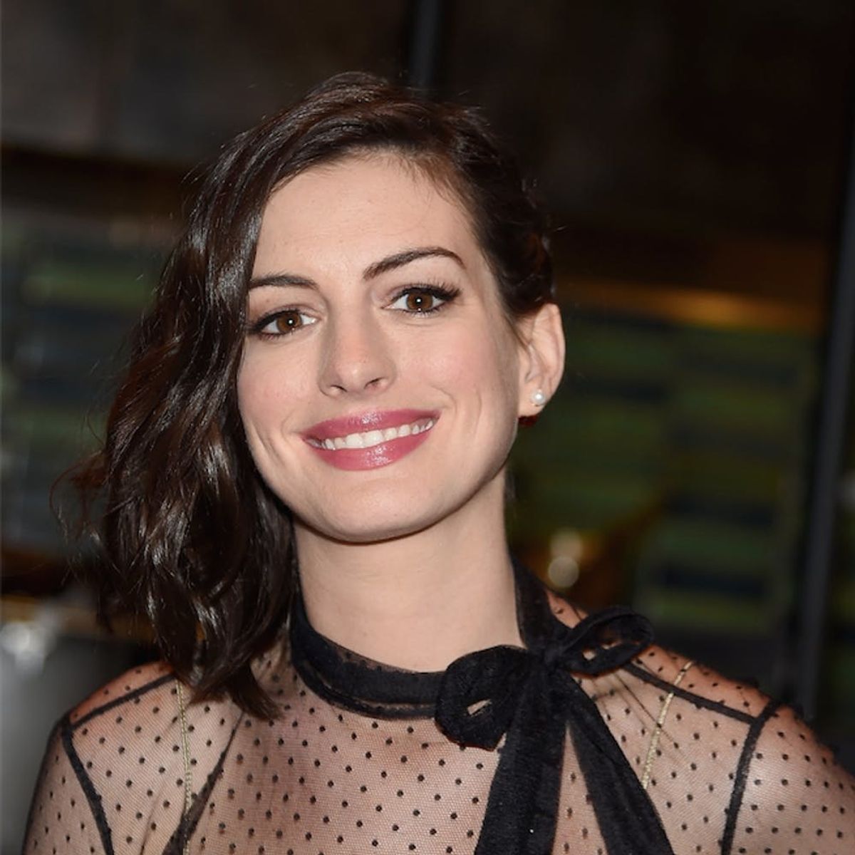 Anne Hathaway Posted Her OWN Baby Bump Reveal (and It’s Amazing)