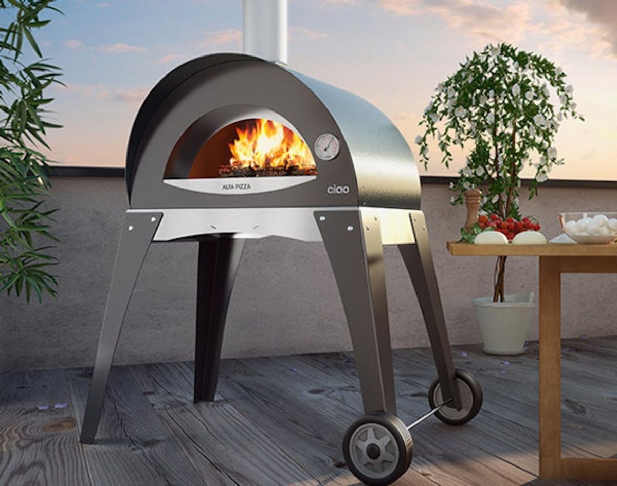 This Portable Grill Cooks Up Wood-Fired Pizza in Your Backyard