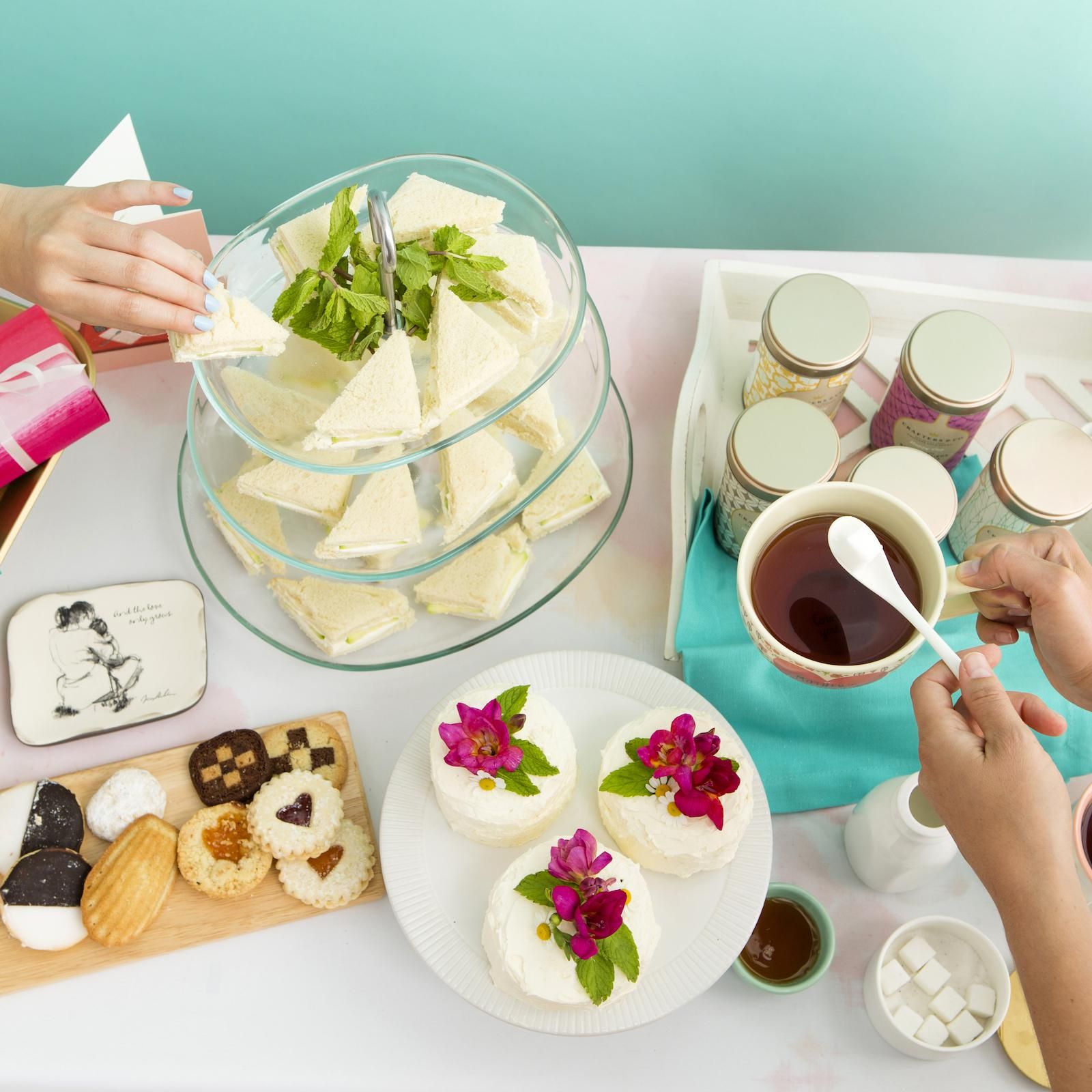an afternoon tea party with cakes and cookies