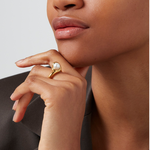 imitation pearl ring on hand