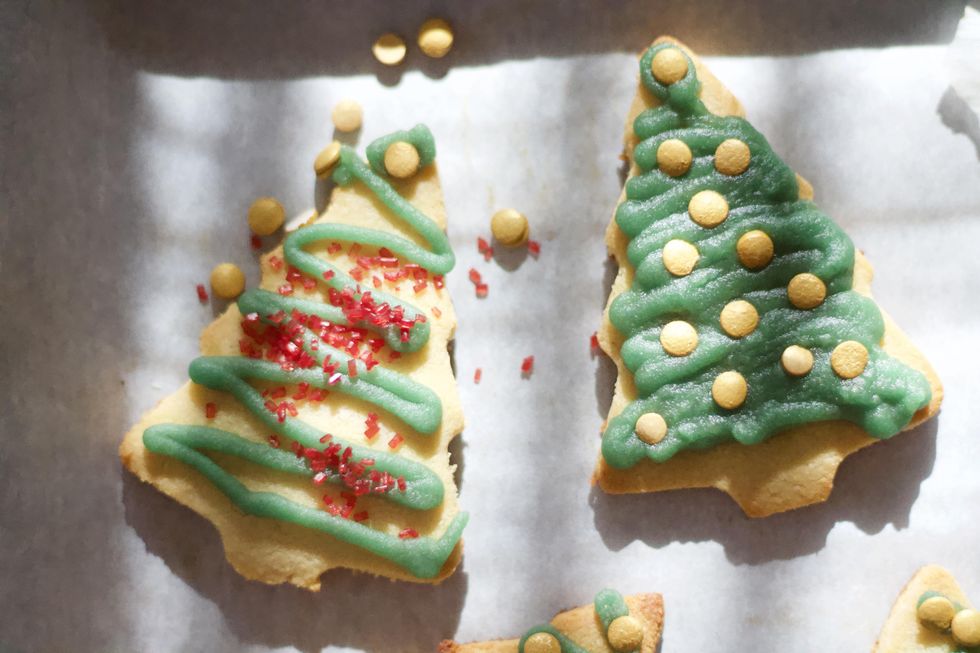 Ingredients for Paleo Christmas cookies, tree-shaped decorated Christmas cookies