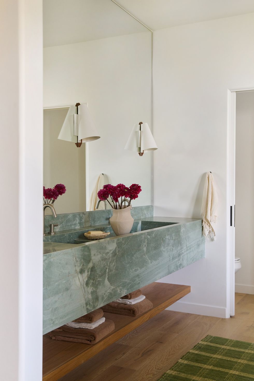 jade bathroom vanity with red flowers