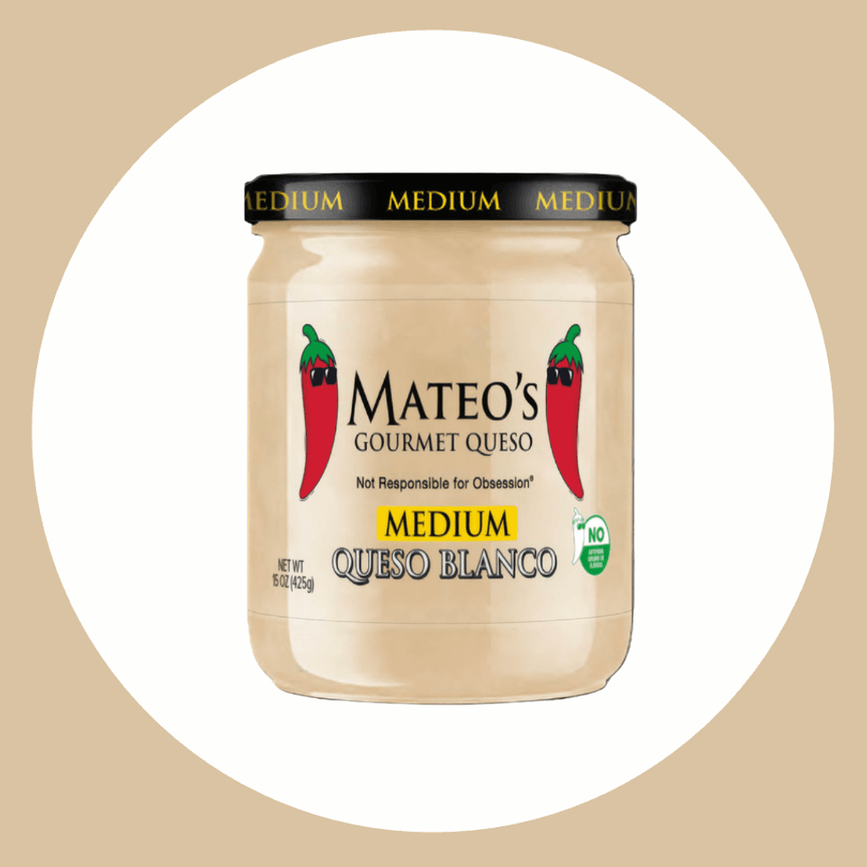 Jar of Mateo's Gourmet Queso Blanco, medium spice, on beige background.