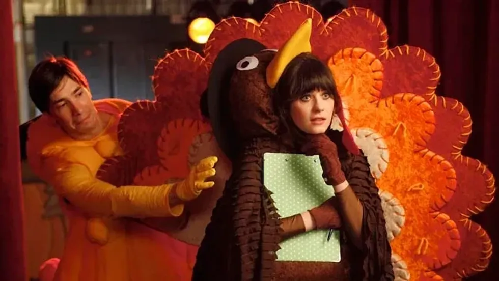 Jess is wearing a turkey costume.