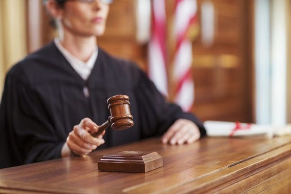 Judge banging gavel in court