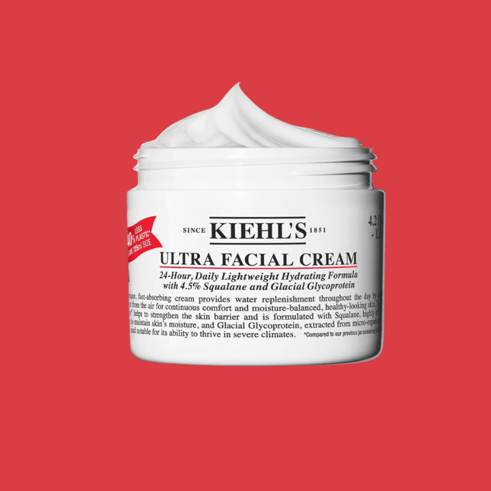 Kiehl's Ultra Facial Cream jar on a red background.