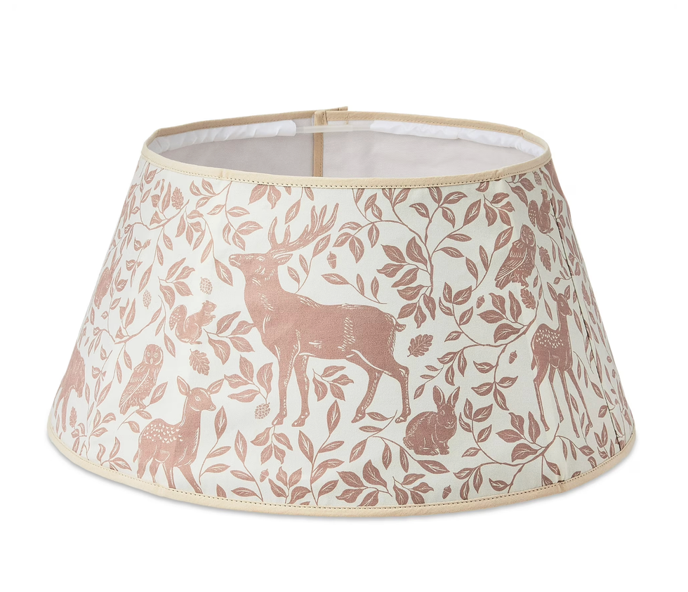 Lampshade with pink wildlife pattern featuring deer, birds, and leaves on a white background.