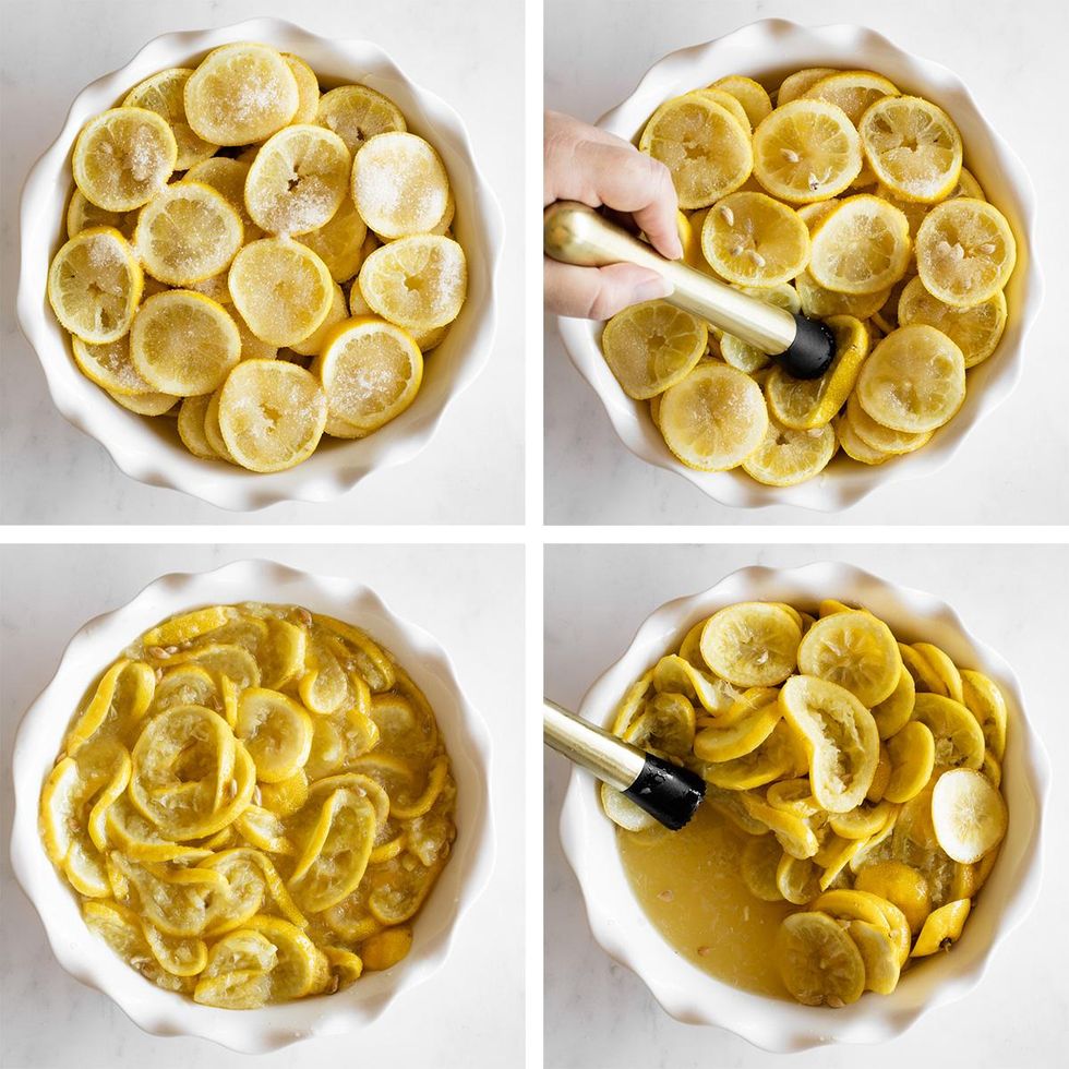 Lemon slices are muddled in a white dish