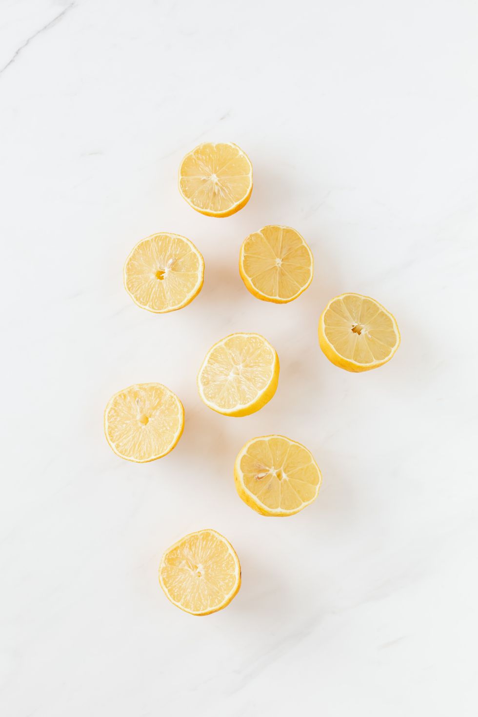 lemon slices arranged on a white background