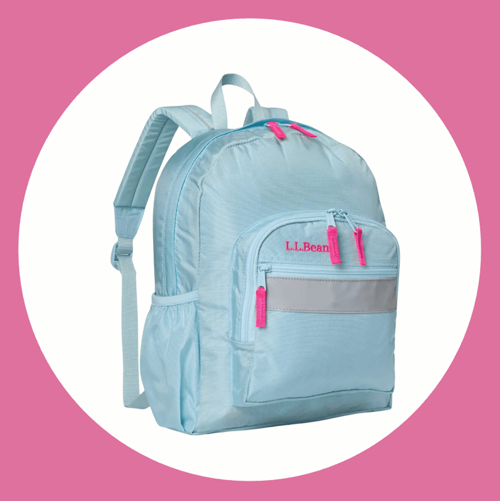 Light blue backpack with pink zippers on a pink and white background.