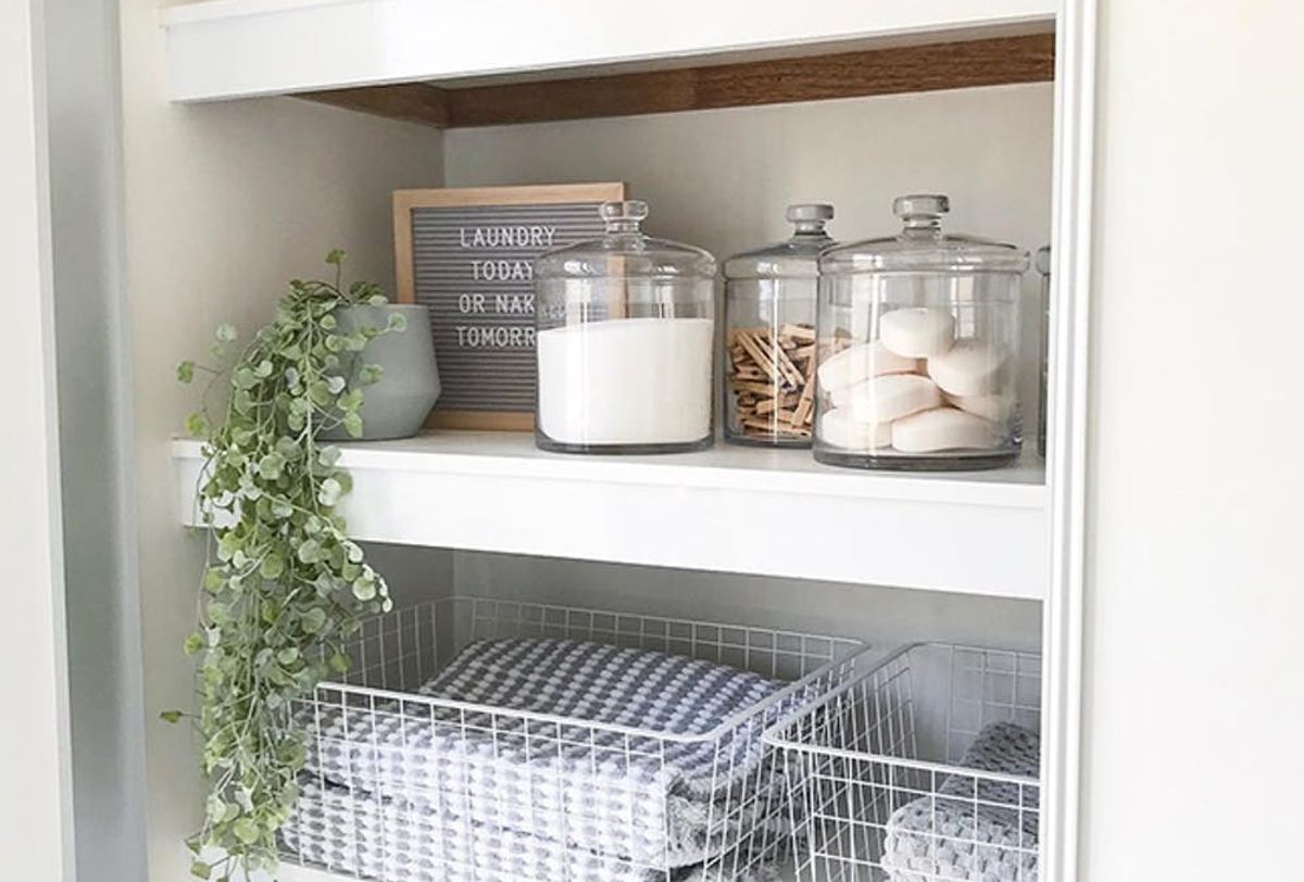 Linen Closet Organization with Baskets: A simple way to eliminate visual  clutter - Organizing Moms