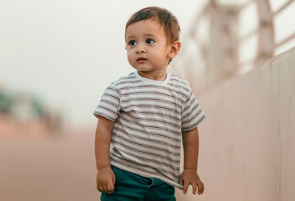 little boy at a beach pier