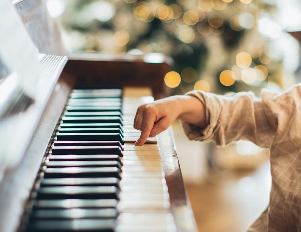 little boy playing the piano