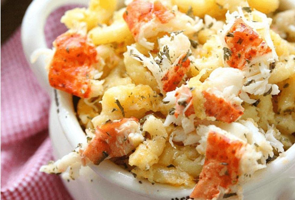 lobster macaroni in a white bowl on a red gingham tablecloth