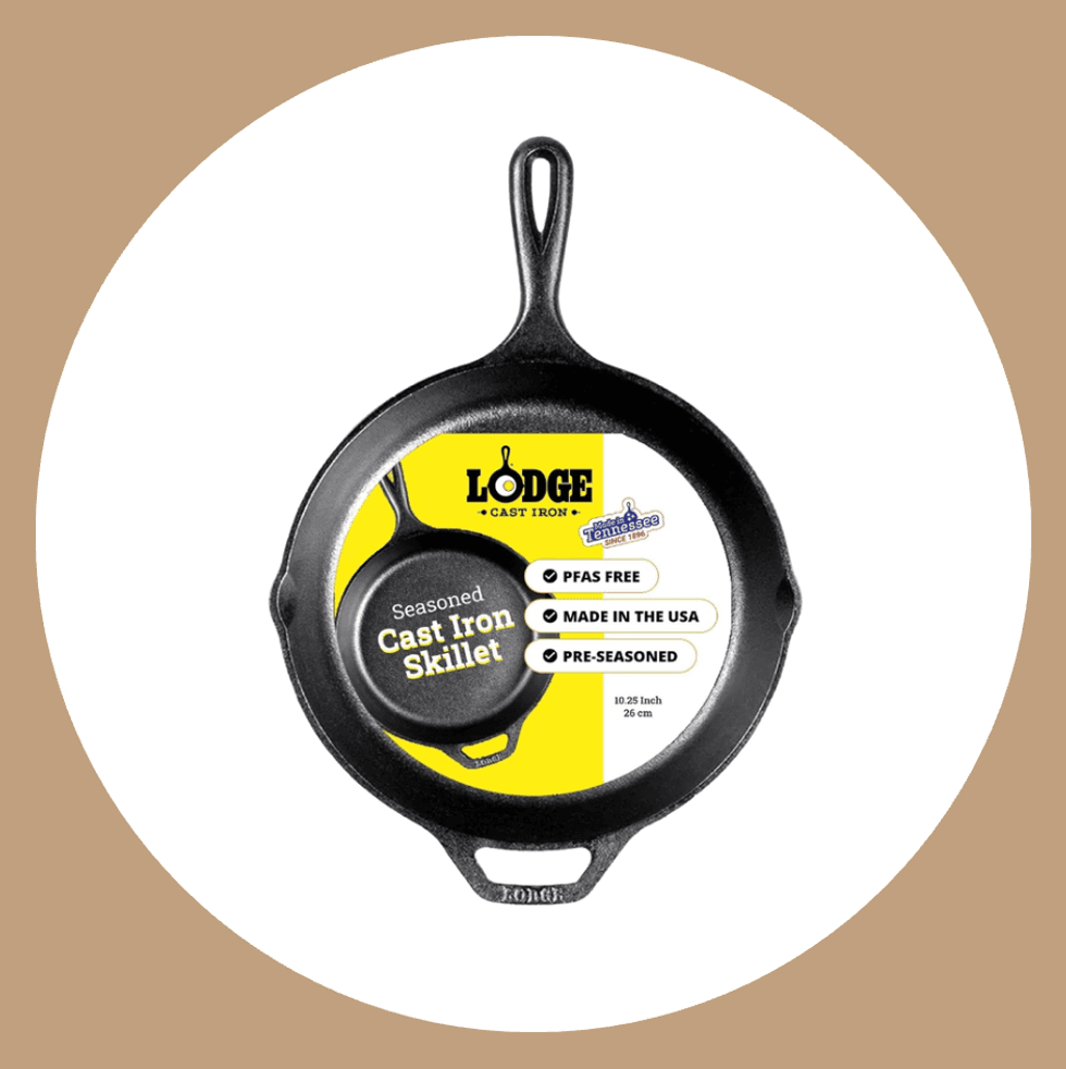 Lodge cast iron skillet with yellow label, PFAS free, pre-seasoned, made in USA.