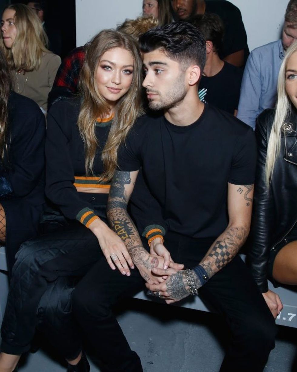 LONDON, ENGLAND - SEPTEMBER 17: Gigi Hadid and Zayn Malik attend the Versus Versace show during London Fashion Week Spring/Summer collections 2016/2017 on September 17, 2016 in London, United Kingdom. (Photo by Darren Gerrish/WireImage)