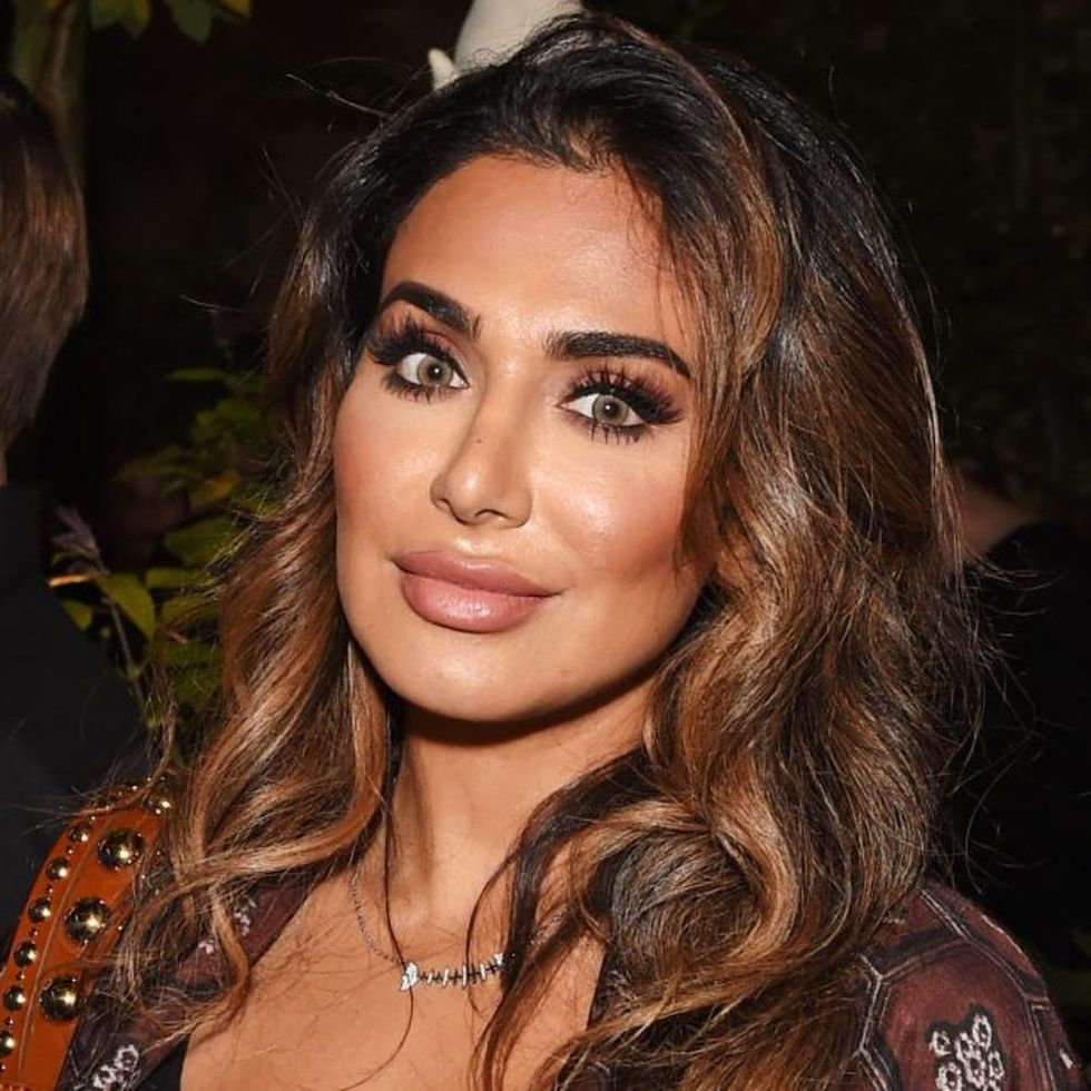 LONDON, ENGLAND - SEPTEMBER 19: Huda Kattan wearing Burberry at theBurberry September 2016 show during London Fashion Week SS17 at Makers House on September 19, 2016 in London, England. (Photo by David M. Benett/Dave Benett / Getty Images for Burberry)