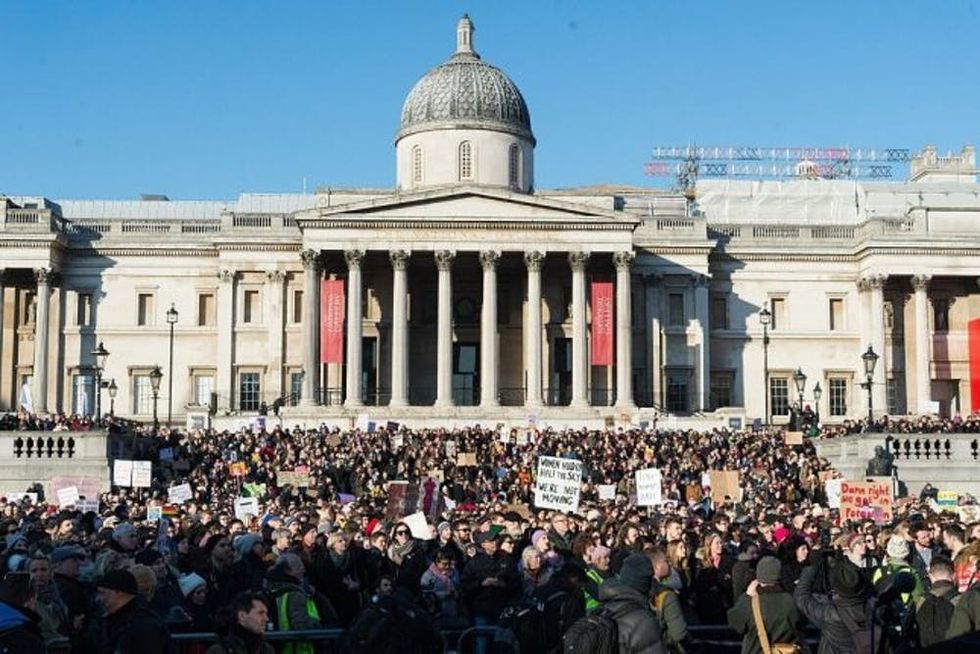 LONDON, UNITED KINGDOM - JANUARY 21: Demonstrators demanding protection of fundamental rights and for the safeguarding of freedoms threatened by recent political events, gather to attend the Women's March in London, United Kingdom on January 21, 2017. (Photo by Ray Tang/Anadolu Agency/Getty Images)