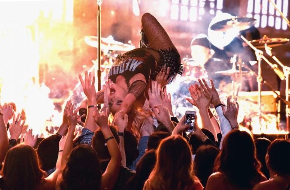 LOS ANGELES, CA - FEBRUARY 12: Musician Lady Gaga crowd surfs during The 59th GRAMMY Awards at STAPLES Center on February 12, 2017 in Los Angeles, California. (Photo by Lester Cohen/Getty Images for NARAS)