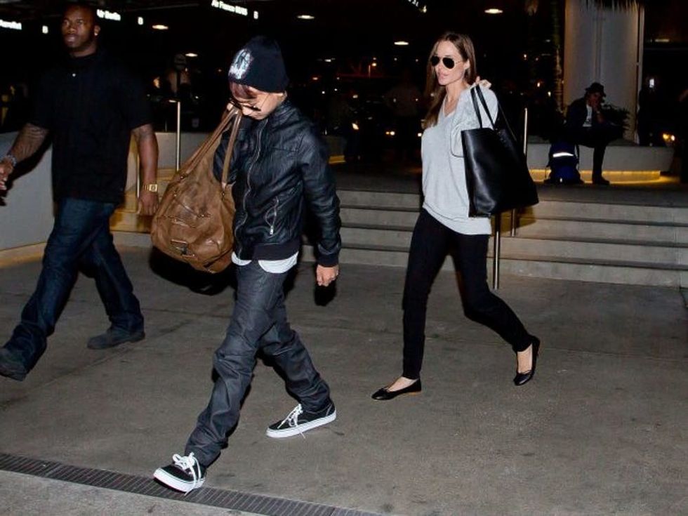 LOS ANGELES, CA - FEBRUARY 14: Maddox Jolie-Pitt and Angelina Jolie are seen at LAX airport on February 14, 2014 in Los Angeles, California. (Photo by GVK/Bauer-Griffin/GC Images)
