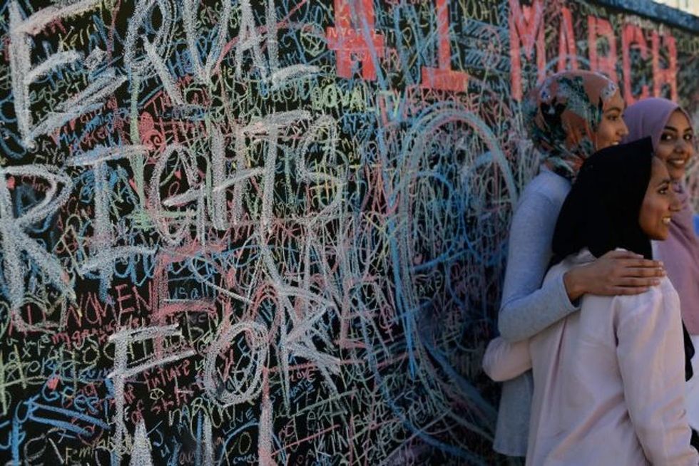 LOS ANGELES, CA - JANUARY 21: Participants pose during the Women's March on January 21, 2017 in Los Angeles, California. Tens of thousands of people took to the streets of Downtown Los Angeles for the Women's March in protest after the inauguration of President Donald Trump. Women's Marches are being held in cities around the world. (Photo by Chelsea Guglielmino/Getty Images)