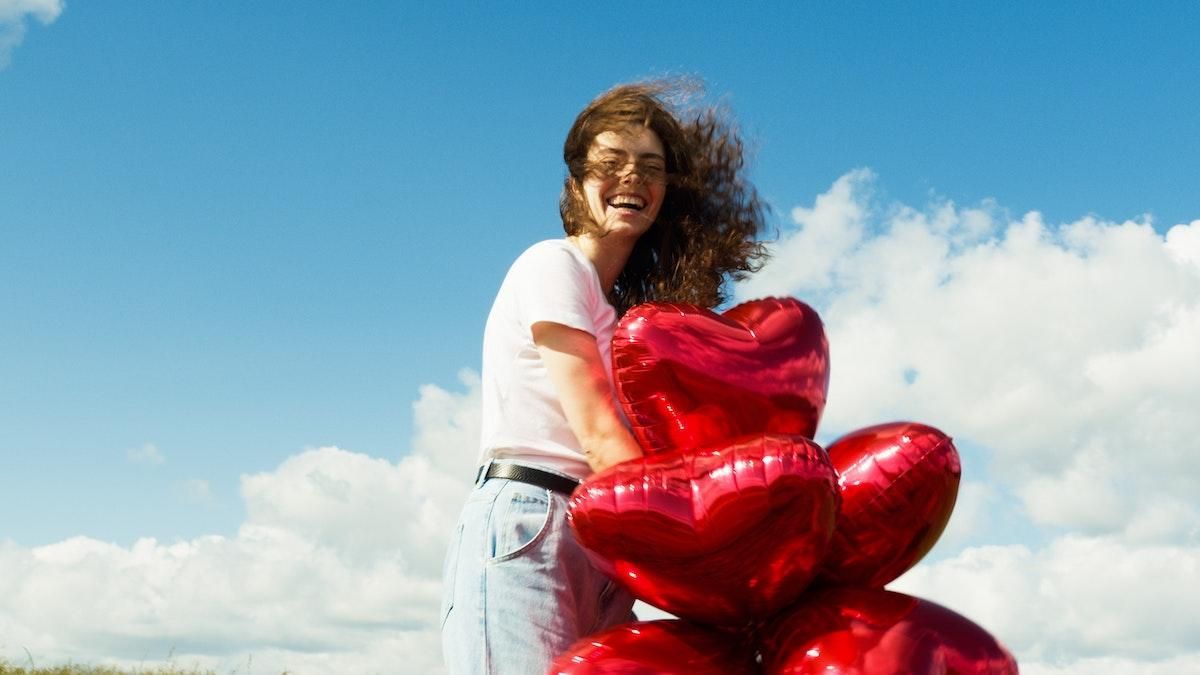 Love Character Test valentine's day 2023 woman holding red heart balloons