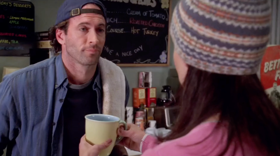 luke pouring lorelai a cup of coffee in the gilmore girls pilot