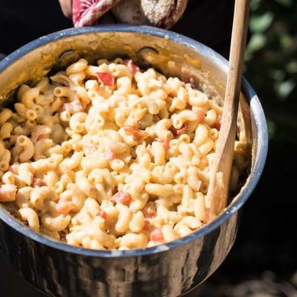 Mac and Cheese in a silver pot is one of the perfect camping recipes