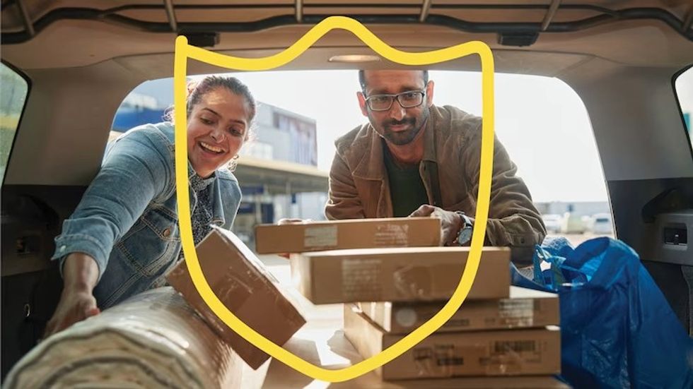 man and woman loading their car with ikea finds