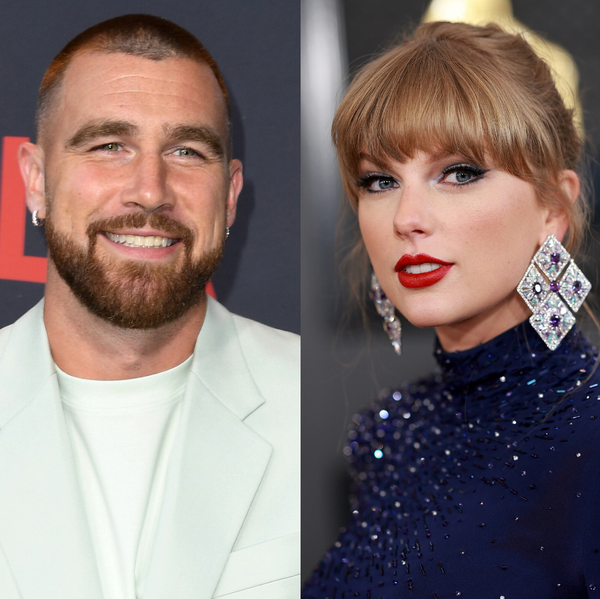 Man and woman side by side, both smiling, dressed in formal attire.