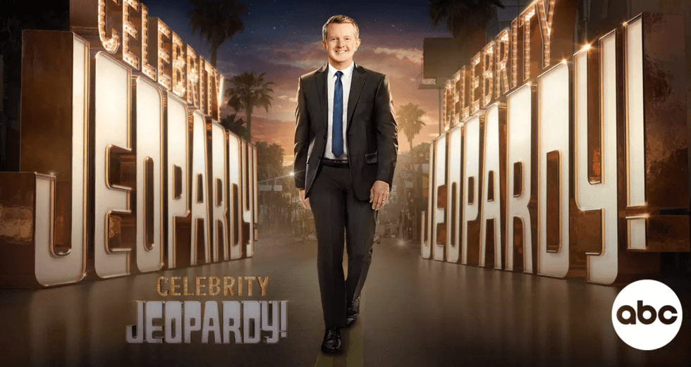 Man in a suit stands in front of large "Celebrity Jeopardy!" sign; ABC logo in the corner.