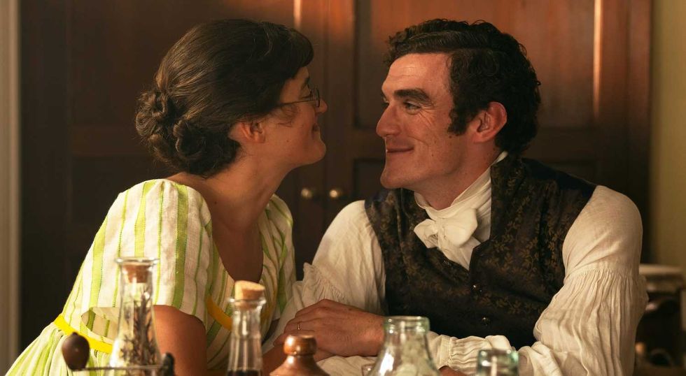 mary and tom sitting in the kitchen smiling at each other