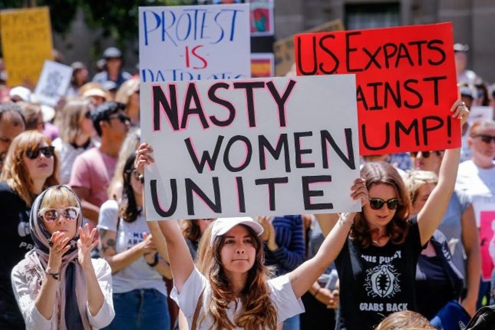 MELBOURNE, AUSTRALIA - JANUARY 21: Protesters take part in the Melbourne rally to protest against the Trump Inauguration on January 21, 2017 in Melbourne, Australia. The marches in Australia were organised to show solidarity with those marching on Washington DC and around the world in defense of women's rights and human rights. (Photo by Wayne Taylor/Getty Images)