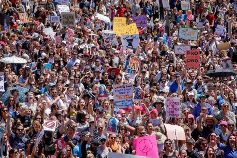 MELBOURNE, AUSTRALIA - JANUARY 21: Protesters take part in the Melbourne rally to protest against the Trump Inauguration on January 21, 2017 in Melbourne, Australia. The marches in Australia were organised to show solidarity with those marching on Washington DC and around the world in defense of women's rights and human rights. (Photo by Wayne Taylor/Getty Images)