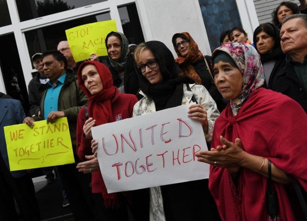 Members of the Islamic and other religious communities listen during a solidarity rally held in conjunction with inter-faith religious leaders, as they respond to President Donald Trump's new executive order on refugees, in Los Angeles, California on February 3, 2017. / AFP / Mark RALSTON (Photo credit should read MARK RALSTON/AFP/Getty Images)