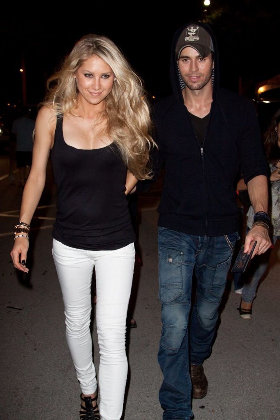 MIAMI - SEPTEMBER 26: Anna Kournikova and Enrique Iglesias leave the Orange Carpet for the Miami Dolphins versus New York Jets game at Sun Life Stadium on September 26, 2010 in Miami, Florida. (Photo by John Parra/WireImage)