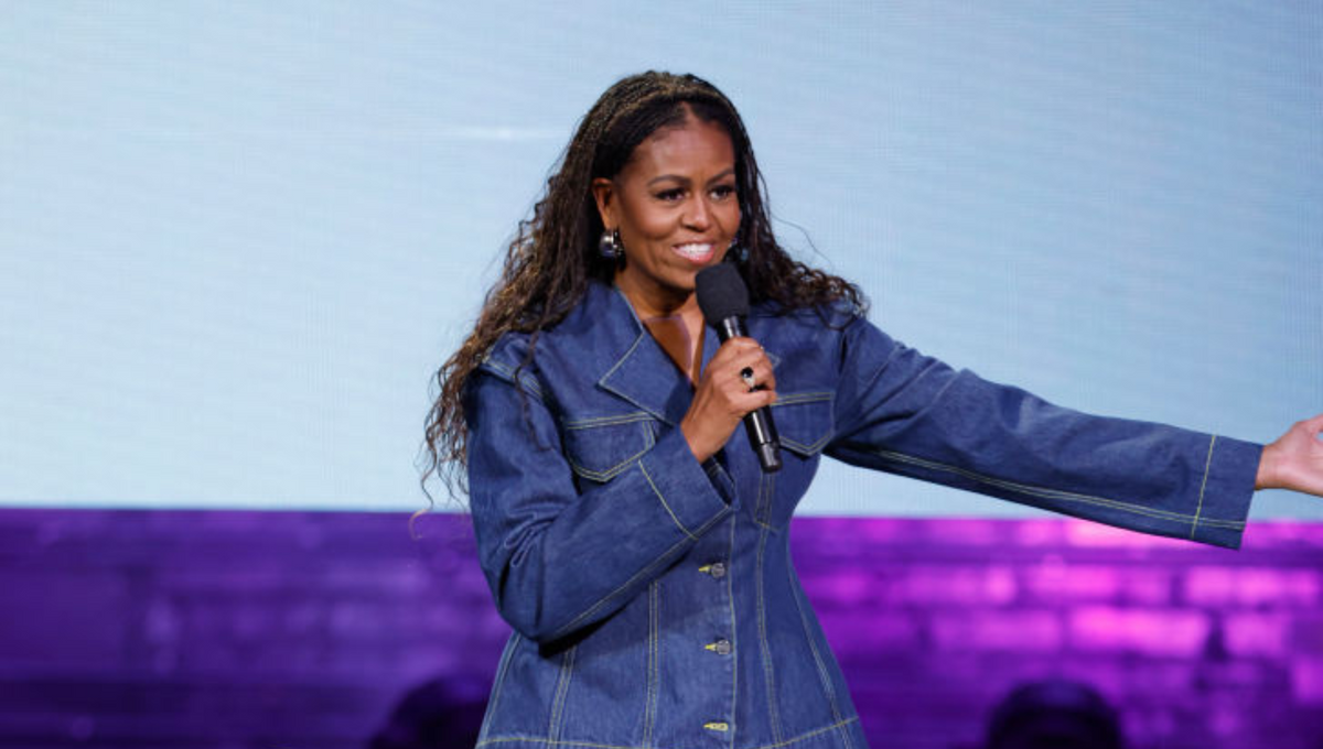 michelle obama onstage in a denim outfit bruce springsteen concert