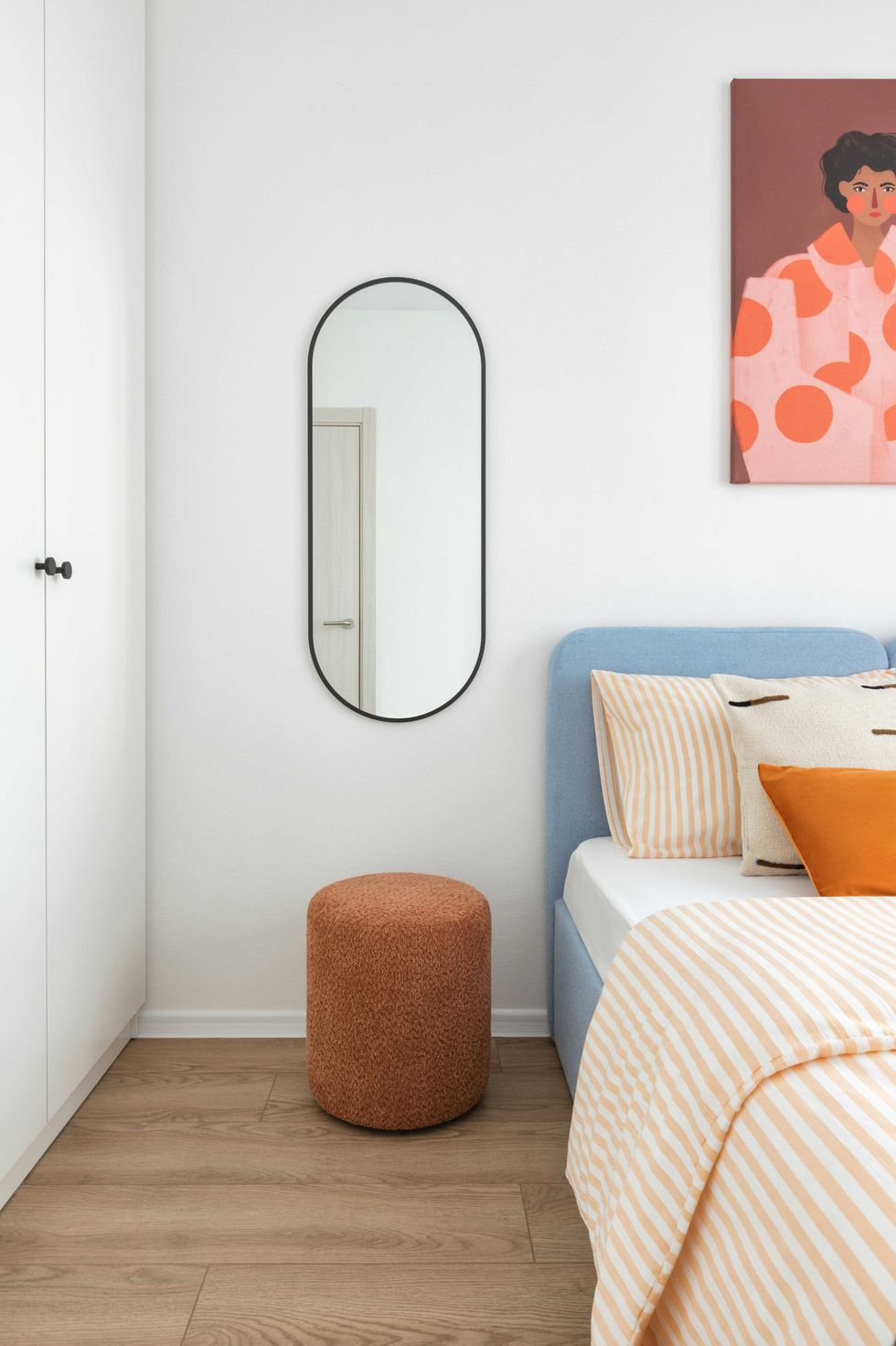 Minimalist bedroom with mirror, stool, and striped bedding.