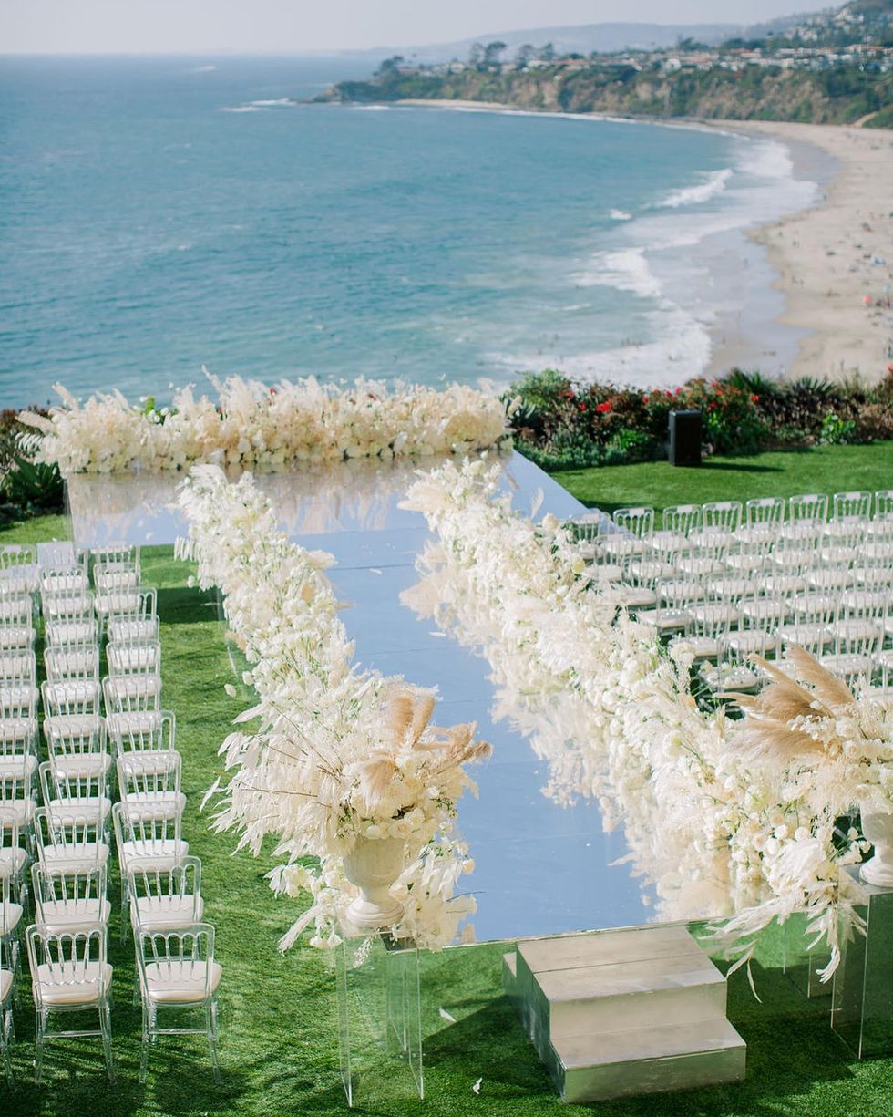 mirrored aisle at a wedding on the coast