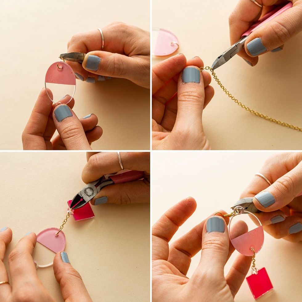 model attaches the chain to the earrings