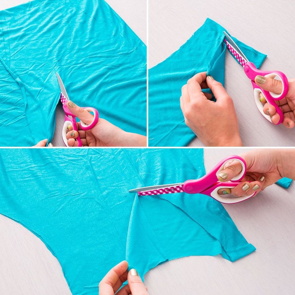 model cuts the blue Beach_Cover_Up with pink scissors