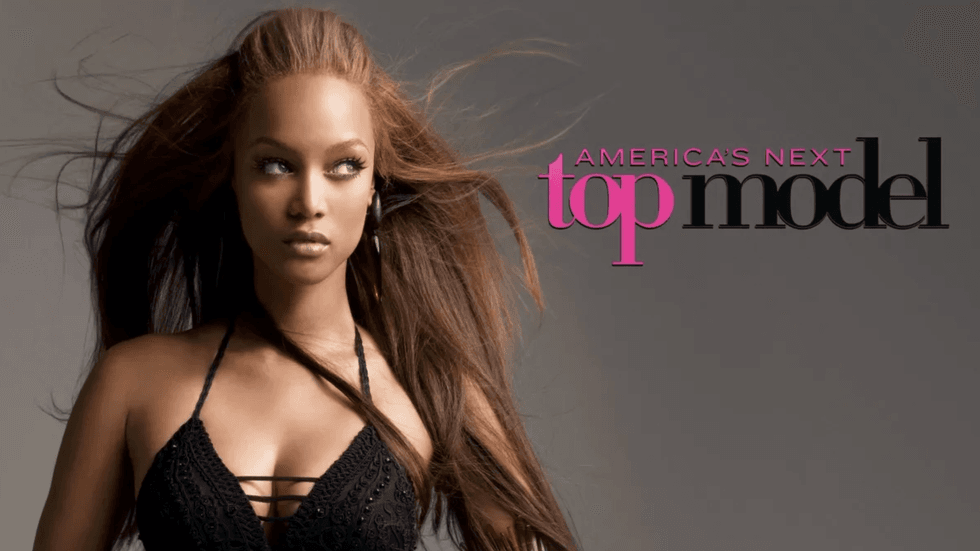 Model posing with flowing hair and "America's Next Top Model" text beside her.