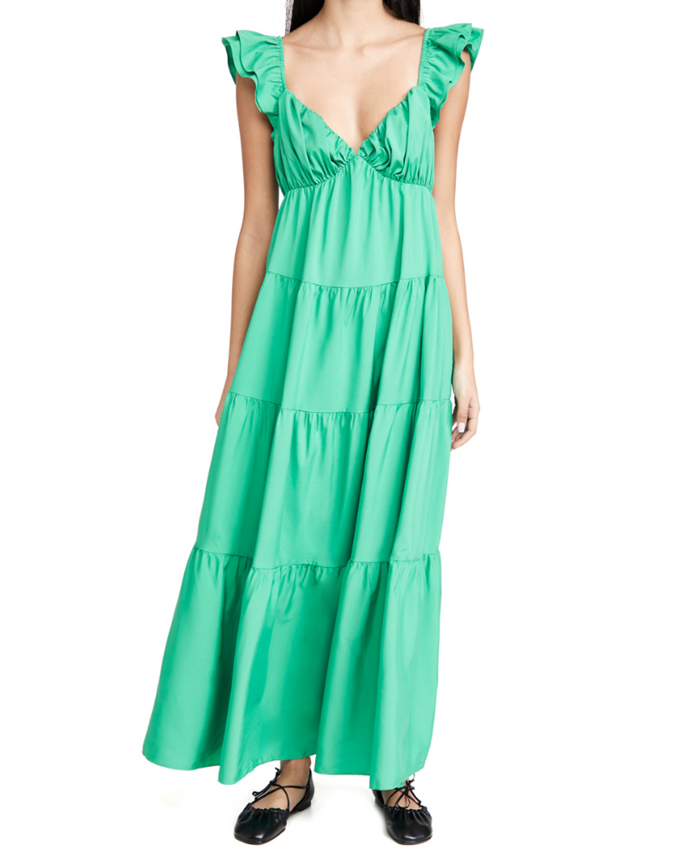 model wearing green dress with black ballet flats