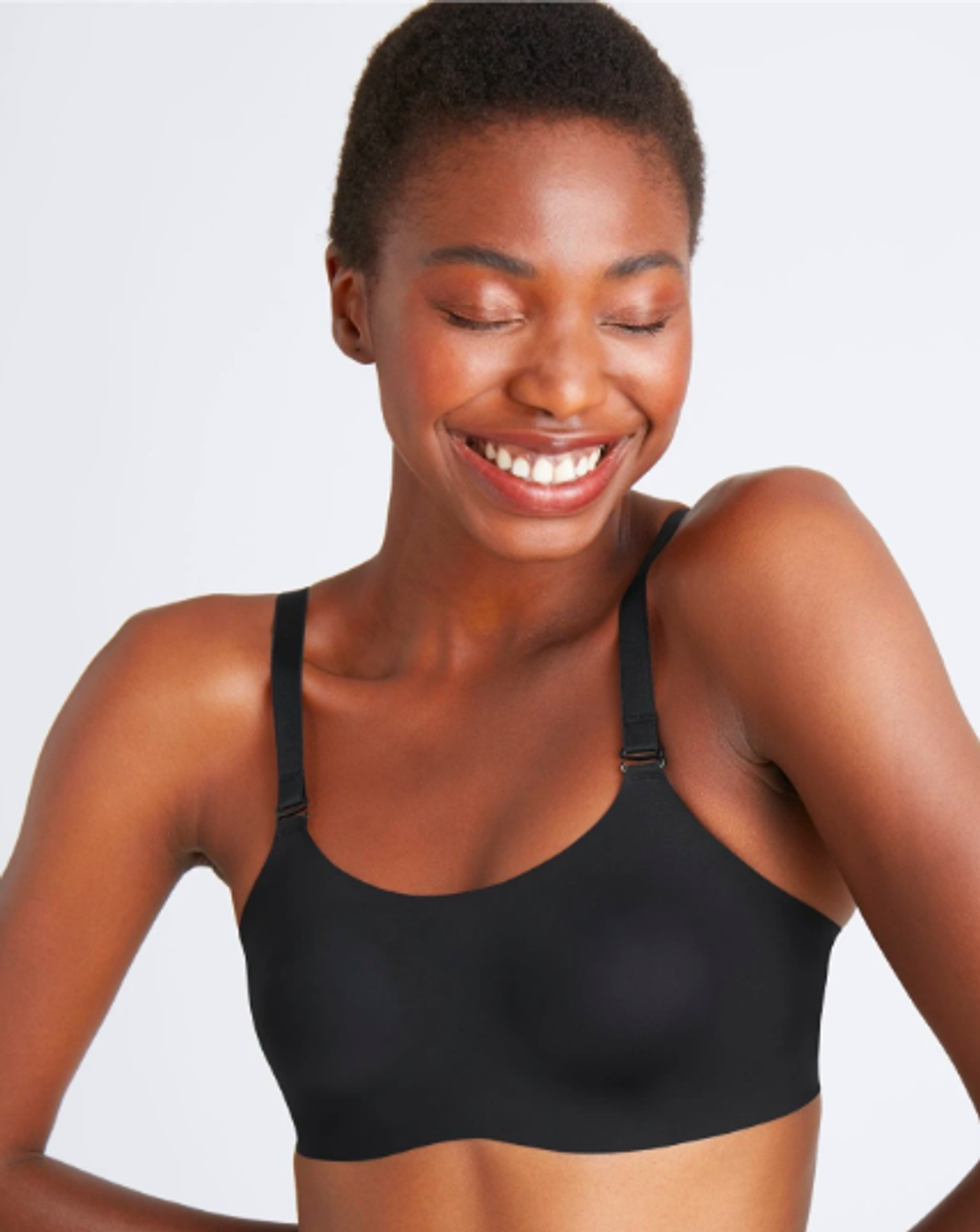 model wears black bra with straps