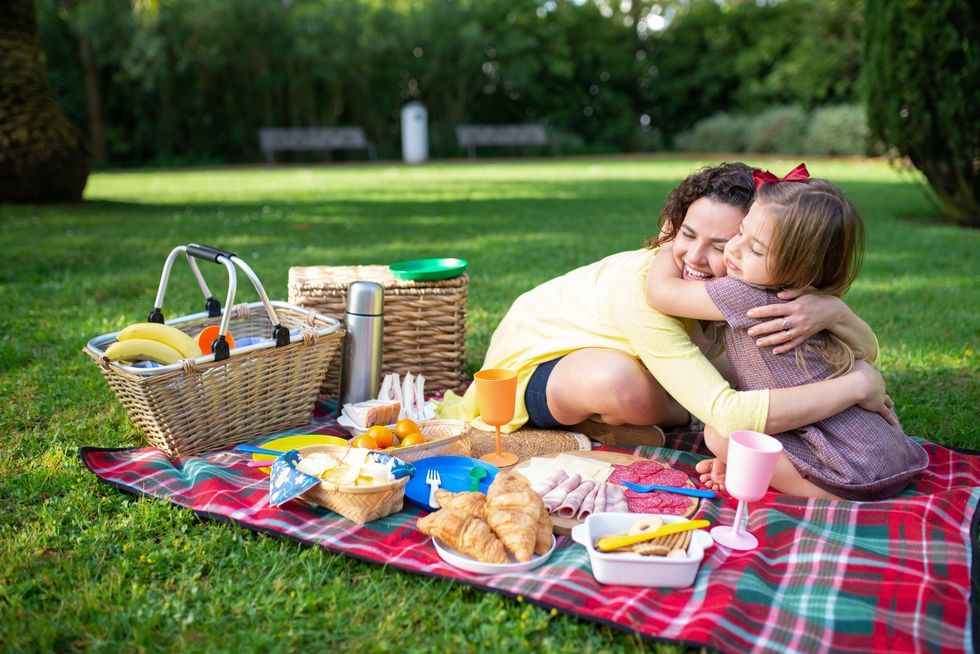 Mom and daughter enjoying picnic